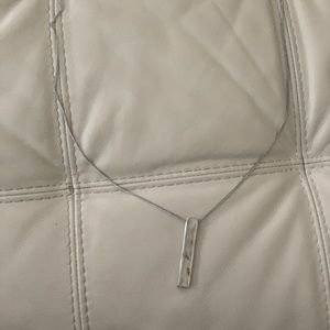 34 inch silver colored necklace.